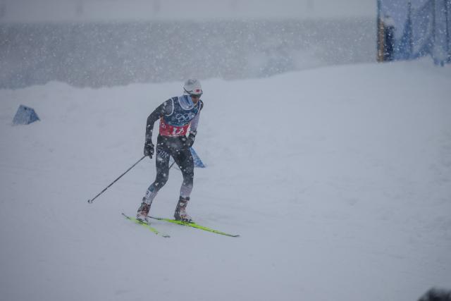 (260219) -- TESERO, Feb. 19, 2026 (Xinhua) -- Zhao Zihe of China competes during the cross-country event of the nordic combined team sprint at the 2026 Milan-Cortina Winter Olympics in Tesero, Italy, Feb. 19, 2026. (Xinhua/Peng Ziyang)