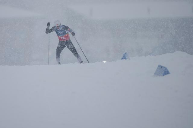 (260219) -- TESERO, Feb. 19, 2026 (Xinhua) -- Zhao Zihe of China competes during the cross-country event of the nordic combined team sprint at the 2026 Milan-Cortina Winter Olympics in Tesero, Italy, Feb. 19, 2026. (Xinhua/Peng Ziyang)