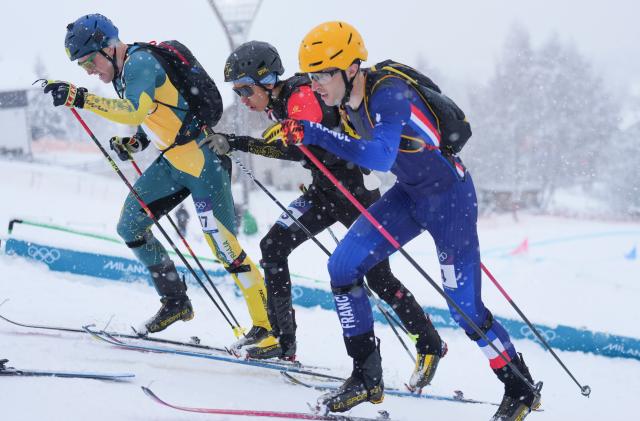 (260219) -- BORMIO, Feb. 19, 2026 (Xinhua) -- Thibault Anselmet of France, Bu Luer of China, Phillip Bellingham of Australia (R to L) compete during the ski mountaineering men's sprint event at the Milan-Cortina 2026 Olympic Winter Games in Bormio, Italy, Feb. 19, 2026. (Xinhua/Hu Huhu)