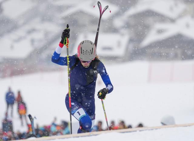 (260219) -- BORMIO, Feb. 19, 2026 (Xinhua) -- Emily Harrop of France competes during the ski mountaineering women's sprint event at the Milan-Cortina 2026 Olympic Winter Games in Bormio, Italy, Feb. 19, 2026. (Xinhua/Hu Huhu)