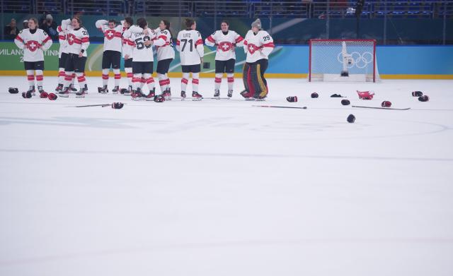 (260219) -- MILAN, Feb. 19, 2026 (Xinhua) -- Players of Switzerland celebrate after winning the ice hockey women's bronze medal game between Switzerland and Sweden at the Milan-Cortina 2026 Olympic Winter Games in Milan, Italy, Feb. 19, 2026. (Xinhua/Tao Xiyi)