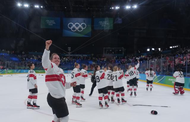 (260219) -- MILAN, Feb. 19, 2026 (Xinhua) -- Players of Switzerland celebrate after winning the ice hockey women's bronze medal game between Switzerland and Sweden at the Milan-Cortina 2026 Olympic Winter Games in Milan, Italy, Feb. 19, 2026. (Xinhua/Tao Xiyi)