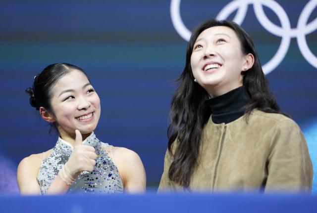 (260219) -- MILAN, Feb. 19, 2026 (Xinhua) -- Zhang Ruiyang (L) of China waits for her score during the free skating match of figure skating women single skating at the Milan-Cortina 2026 Olympic Winter Games in Milan, Italy, Feb. 19, 2026. (Xinhua/Xue Yuge)