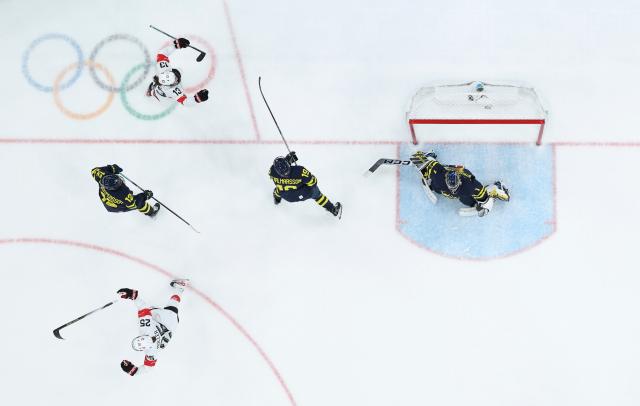 (260219) -- MILAN, Feb. 19, 2026 (Xinhua) -- Alina Muller (L, bottom) of Switzerland celebrates scoring during the ice hockey women's bronze medal game between Switzerland and Sweden at the Milan-Cortina 2026 Olympic Winter Games in Milan, Italy, Feb. 19, 2026. (Xinhua/Wang Kaiyan)