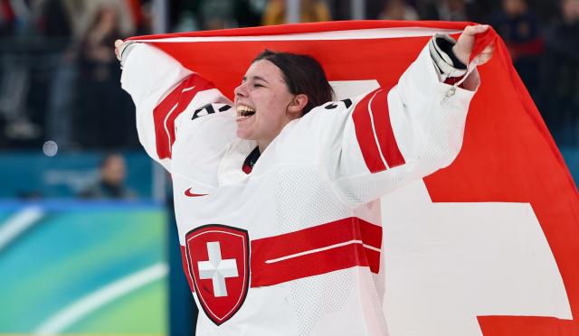 (260219) -- MILAN, Feb. 19, 2026 (Xinhua) -- Goalkeeper Andrea Braendli of Switzerland celebrates after the ice hockey women's bronze medal game between Switzerland and Sweden at the Milan-Cortina 2026 Olympic Winter Games in Milan, Italy, Feb. 19, 2026. (Xinhua/Wang Kaiyan)