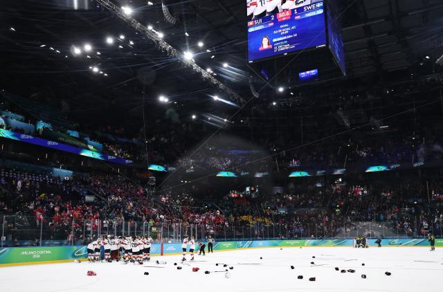 (260219) -- MILAN, Feb. 19, 2026 (Xinhua) -- Players of Switzerland celebrate winning the ice hockey women's bronze medal game between Switzerland and Sweden at the Milan-Cortina 2026 Olympic Winter Games in Milan, Italy, Feb. 19, 2026. (Xinhua/Wang Kaiyan)