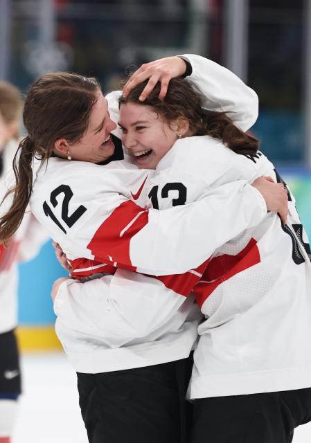 (260219) -- MILAN, Feb. 19, 2026 (Xinhua) -- Lisa Ruedi (L) and Ivana Wey of Switzerland celebrate after winning the ice hockey women's bronze medal game between Switzerland and Sweden at the Milan-Cortina 2026 Olympic Winter Games in Milan, Italy, Feb. 19, 2026. (Xinhua/Wang Kaiyan)