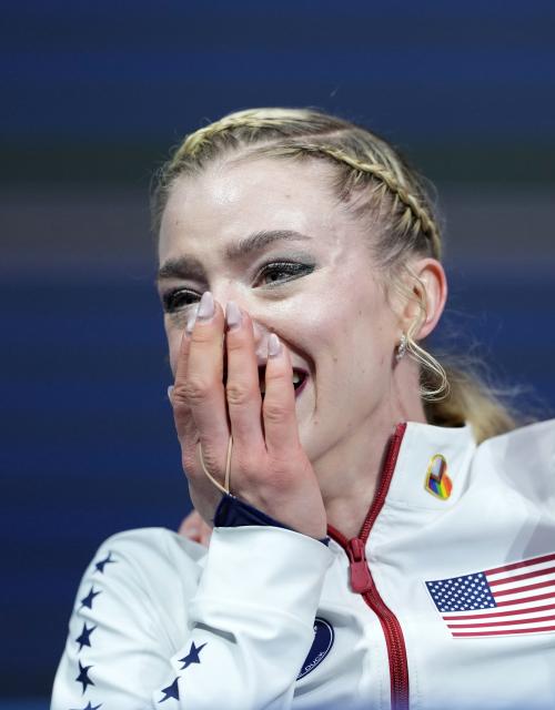 (260219) -- MILAN, Feb. 19, 2026 (Xinhua) -- Amber Glenn of the United States reacts while waiting for her score competes during the free skating match of figure skating women single skating at the Milan-Cortina 2026 Olympic Winter Games in Milan, Italy, Feb. 19, 2026. (Xinhua/Xue Yuge)