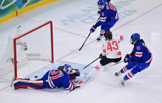 (260219) -- MILAN, Feb. 19, 2026 (Xinhua) -- Kristin O'Neill of Canada (C) scores during the ice hockey women's gold medal game between the United States and Canada at the Milan-Cortina 2026 Olympic Winter Games in Milan, Italy, Feb. 19, 2026. (Xinhua/Tao Xiyi)