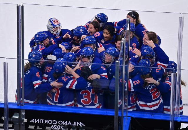 (260219) -- MILAN, Feb. 19, 2026 (Xinhua) -- Players of the United States celebrate after the ice hockey women's gold medal game between the United States and Canada at the Milan-Cortina 2026 Olympic Winter Games in Milan, Italy, Feb. 19, 2026. (Xinhua/Tao Xiyi)