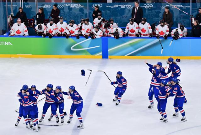 (260219) -- MILAN, Feb. 19, 2026 (Xinhua) -- Players of the United States celebrate after the ice hockey women's gold medal game between the United States and Canada at the Milan-Cortina 2026 Olympic Winter Games in Milan, Italy, Feb. 19, 2026. (Xinhua/Tao Xiyi)