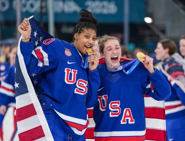 (260219) -- MILAN, Feb. 19, 2026 (Xinhua) -- Laila Edwards and Caroline Harvey of the United States celebrate after the ice hockey women's gold medal game between the United States and Canada at the Milan-Cortina 2026 Olympic Winter Games in Milan, Italy, Feb. 19, 2026. (Xinhua/Sun Fei)