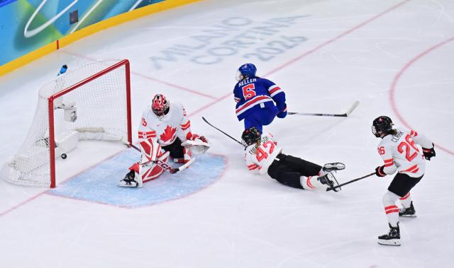 (260219) -- MILAN, Feb. 19, 2026 (Xinhua) -- Megan Keller of the United States scores during the ice hockey women's gold medal game between the United States and Canada at the Milan-Cortina 2026 Olympic Winter Games in Milan, Italy, Feb. 19, 2026. (Xinhua/Tao Xiyi)
