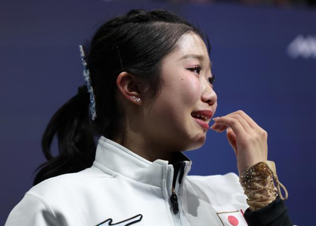 (260219) -- MILAN, Feb. 19, 2026 (Xinhua) -- Nakai Ami of Japan weeps after the free skating match of figure skating women single skating at the Milan-Cortina 2026 Olympic Winter Games in Milan, Italy, Feb. 19, 2026. (Xinhua/Li Ming)