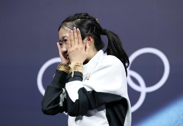 (260219) -- MILAN, Feb. 19, 2026 (Xinhua) -- Nakai Ami of Japan reacts after the free skating match of figure skating women single skating at the Milan-Cortina 2026 Olympic Winter Games in Milan, Italy, Feb. 19, 2026. (Xinhua/Li Ming)