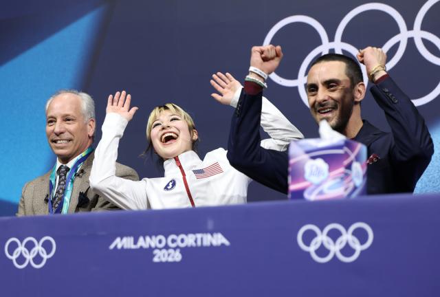 (260219) -- MILAN, Feb. 19, 2026 (Xinhua) -- Alysa Liu (C) of the United States celebrates after the free skating match of figure skating women single skating at the Milan-Cortina 2026 Olympic Winter Games in Milan, Italy, Feb. 19, 2026. (Xinhua/Li Ming)