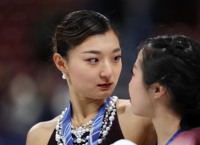 (260220) -- MILAN, Feb. 20, 2026 (Xinhua) -- Silver medalist Sakamoto Kaori (L) of Japan interacts with bronze medalist, her teammate Nakai Ami, after the awarding ceremony of the figure skating women single skating event at the Milan-Cortina 2026 Olympic Winter Games in Milan, Italy, Feb. 19, 2026. (Xinhua/Li Ming)