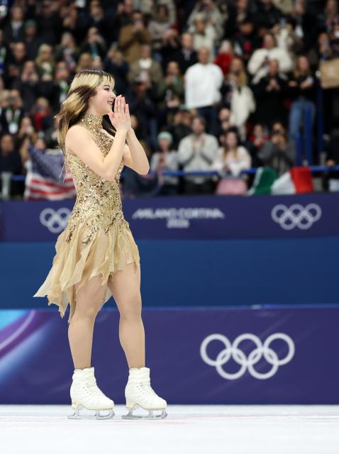 (260220) -- MILAN, Feb. 20, 2026 (Xinhua) -- Gold medalist Alysa Liu of the United States enters the court before the awarding ceremony of the figure skating women single skating event at the Milan-Cortina 2026 Olympic Winter Games in Milan, Italy, Feb. 19, 2026. (Xinhua/Li Ming)
