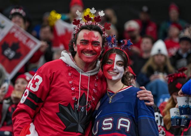 (260220) -- MILAN, Feb. 20, 2026 (Xinhua) -- Fans cheer for both teams before the ice hockey women's gold medal game between the United States and Canada at the Milan-Cortina 2026 Olympic Winter Games in Milan, Italy, Feb. 19, 2026. (Xinhua/Sun Fei)