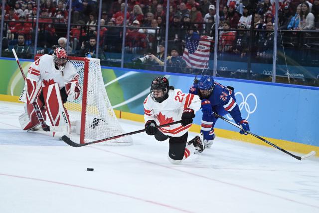 (260220) -- MILAN, Feb. 20, 2026 (Xinhua) -- Joy Dunne (R) of the United States makes a foul during the ice hockey women's gold medal game between the United States and Canada at the Milan-Cortina 2026 Olympic Winter Games in Milan, Italy, Feb. 19, 2026. (Xinhua/Zhang Haofu)