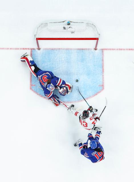 (260220) -- MILAN, Feb. 20, 2026 (Xinhua) -- Kristin O'neill (C) of the United States shoots to score during the ice hockey women's gold medal game between the United States and Canada at the Milan-Cortina 2026 Olympic Winter Games in Milan, Italy, Feb. 19, 2026. (Xinhua/Sun Fei)