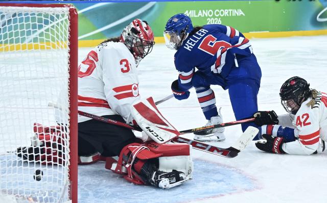 (260220) -- MILAN, Feb. 20, 2026 (Xinhua) -- Megan Keller (C) of the United States scores during the ice hockey women's gold medal game between the United States and Canada at the Milan-Cortina 2026 Olympic Winter Games in Milan, Italy, Feb. 19, 2026. (Xinhua/Zhang Haofu)