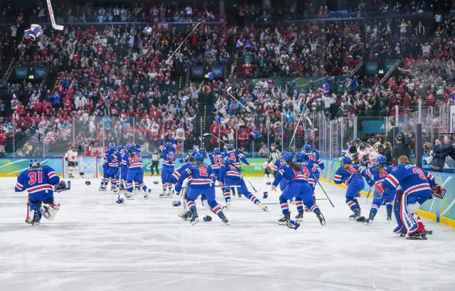 (260220) -- MILAN, Feb. 20, 2026 (Xinhua) -- Players of the United States celebrate victory after the ice hockey women's gold medal game between the United States and Canada at the Milan-Cortina 2026 Olympic Winter Games in Milan, Italy, Feb. 19, 2026. (Xinhua/Sun Fei)