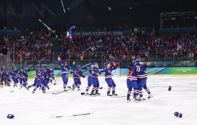 (260220) -- MILAN, Feb. 20, 2026 (Xinhua) -- Players of the United States celebrate victory after the ice hockey women's gold medal game between the United States and Canada at the Milan-Cortina 2026 Olympic Winter Games in Milan, Italy, Feb. 19, 2026. (Xinhua/Wang Kaiyan)