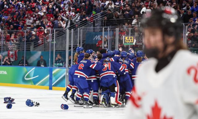 (260220) -- MILAN, Feb. 20, 2026 (Xinhua) -- Players of the United States celebrate victory after the ice hockey women's gold medal game between the United States and Canada at the Milan-Cortina 2026 Olympic Winter Games in Milan, Italy, Feb. 19, 2026. (Xinhua/Wang Kaiyan)