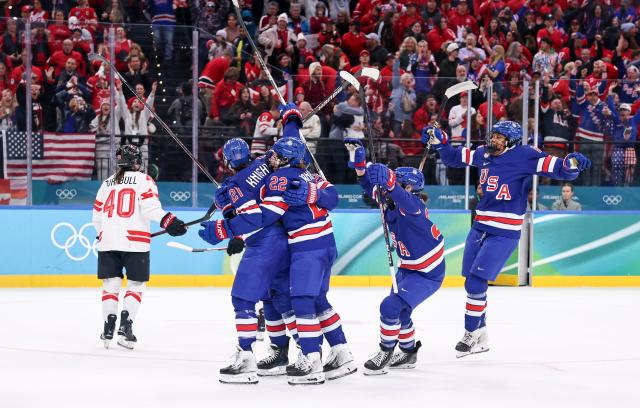 (260220) -- MILAN, Feb. 20, 2026 (Xinhua) -- Players of the United States celebrate a goal during the ice hockey women's gold medal game between the United States and Canada at the Milan-Cortina 2026 Olympic Winter Games in Milan, Italy, Feb. 19, 2026. (Xinhua/Wang Kaiyan)