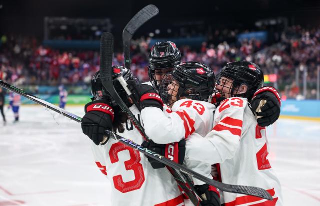 (260220) -- MILAN, Feb. 20, 2026 (Xinhua) -- Players of Canada celebrate a goal during the ice hockey women's gold medal game between the United States and Canada at the Milan-Cortina 2026 Olympic Winter Games in Milan, Italy, Feb. 19, 2026. (Xinhua/Wang Kaiyan)