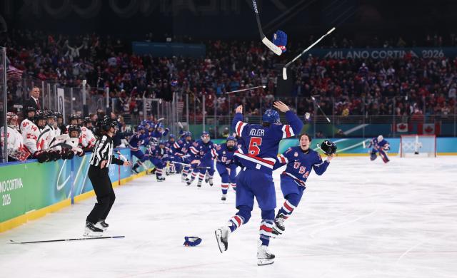 (260220) -- MILAN, Feb. 20, 2026 (Xinhua) -- Players of the United States celebrate victory after the ice hockey women's gold medal game between the United States and Canada at the Milan-Cortina 2026 Olympic Winter Games in Milan, Italy, Feb. 19, 2026. (Xinhua/Wang Kaiyan)