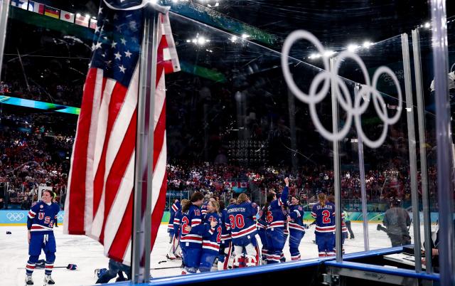 (260220) -- MILAN, Feb. 20, 2026 (Xinhua) -- Players of the United States celebrate victory after the ice hockey women's gold medal game between the United States and Canada at the Milan-Cortina 2026 Olympic Winter Games in Milan, Italy, Feb. 19, 2026. (Xinhua/Wang Kaiyan)