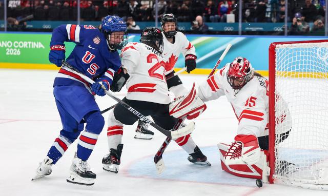 (260220) -- MILAN, Feb. 20, 2026 (Xinhua) -- Goalkeeper Ann-Renee Desbiens (1st R) of Canada makes a save during the ice hockey women's gold medal game between the United States and Canada at the Milan-Cortina 2026 Olympic Winter Games in Milan, Italy, Feb. 19, 2026. (Xinhua/Wang Kaiyan)