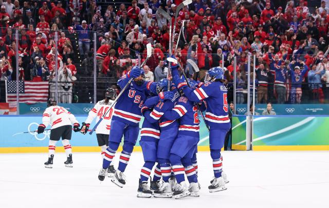 (260220) -- MILAN, Feb. 20, 2026 (Xinhua) -- Players of the United States celebrate a goal during the ice hockey women's gold medal game between the United States and Canada at the Milan-Cortina 2026 Olympic Winter Games in Milan, Italy, Feb. 19, 2026. (Xinhua/Wang Kaiyan)
