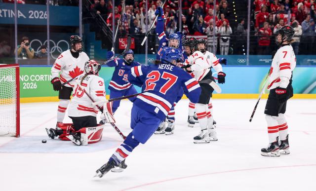 (260220) -- MILAN, Feb. 20, 2026 (Xinhua) -- Players of the United States celebrate a goal during the ice hockey women's gold medal game between the United States and Canada at the Milan-Cortina 2026 Olympic Winter Games in Milan, Italy, Feb. 19, 2026. (Xinhua/Wang Kaiyan)