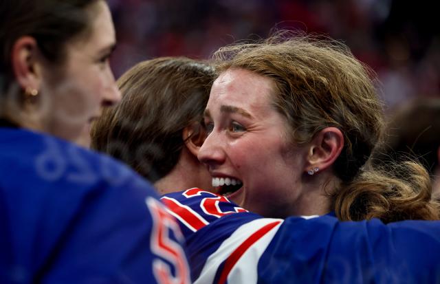 (260220) -- MILAN, Feb. 20, 2026 (Xinhua) -- Players of the United States celebrate victory after the ice hockey women's gold medal game between the United States and Canada at the Milan-Cortina 2026 Olympic Winter Games in Milan, Italy, Feb. 19, 2026. (Xinhua/Wang Kaiyan)
