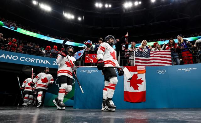 (260220) -- MILAN, Feb. 20, 2026 (Xinhua) -- Players of Canada walk into the court before the ice hockey women's gold medal game between the United States and Canada at the Milan-Cortina 2026 Olympic Winter Games in Milan, Italy, Feb. 19, 2026. (Xinhua/Wang Kaiyan)