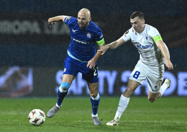 (260220) -- ZAGREB, Feb. 20, 2026 (Xinhua) -- Bryan Heyen of KRC Genk vies with Josip Misic (L) of GNK Dinamo during the UEFA Europa League 2025/26 Knockout Play-off First Leg match between GNK Dinamo and KRC Genk at Stadion Maksimir in Zagreb, Croatia, on Feb. 19, 2026. (Photo by Marko Lukunic/PIXSELL via Xinhua)