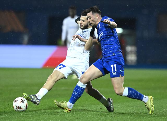 (260220) -- ZAGREB, Feb. 20, 2026 (Xinhua) -- Zakaria el Ouahdi of KRC Genk vies with Arber Hoxha (R) of GNK Dinamo during the UEFA Europa League 2025/26 Knockout Play-off First Leg match between GNK Dinamo and KRC Genk at Stadion Maksimir in Zagreb, Croatia, on Feb. 19, 2026. (Photo by Marko Lukunic/PIXSELL via Xinhua)