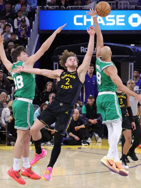 (260220) -- SAN FRANCISCO, Feb. 20, 2026 (Xinhua) -- Brandin Podziemski (C) of Golden State Warriors vies for the ball during the 2025-2026 NBA regular season game between Golden State Warriors and Boston Celtics in San Francisco, the United States, Feb. 19, 2026. (Photo by Arthur Dong/Xinhua)