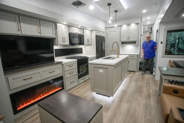 (260220) -- ABBOTSFORD, Feb. 20, 2026 (Xinhua) -- A man views the interior of a luxury travel trailer at the 2026 Earlybird RV (recreational vehicles) Show & Sale in Abbotsford, British Columbia, Canada, on Feb. 19, 2026. The four-day event kicked off here on Thursday. (Photo by Liang Sen/Xinhua)