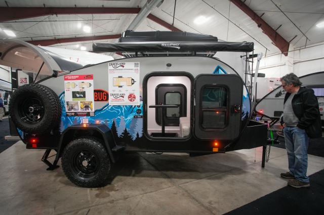 (260220) -- ABBOTSFORD, Feb. 20, 2026 (Xinhua) -- A man looks at a travel trailer at the 2026 Earlybird RV (recreational vehicles) Show & Sale in Abbotsford, British Columbia, Canada, on Feb. 19, 2026. The four-day event kicked off here on Thursday. (Photo by Liang Sen/Xinhua)