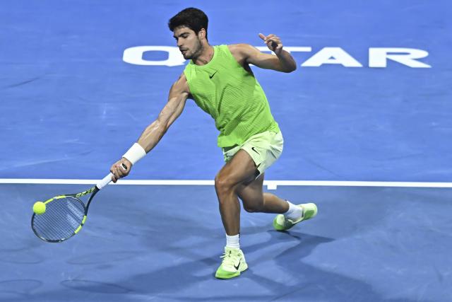 (260220) -- DOHA, Feb. 20, 2026 (Xinhua) -- Carlos Alcaraz of Spain hits a return during the men's singles quarterfinal match between Carlos Alcaraz of Spain and Karen Khachanov of Russia at the ATP Qatar Open 2026 tennis tournament in Doha, Qatar, Feb. 19, 2026. (Photo by Nikku/Xinhua)