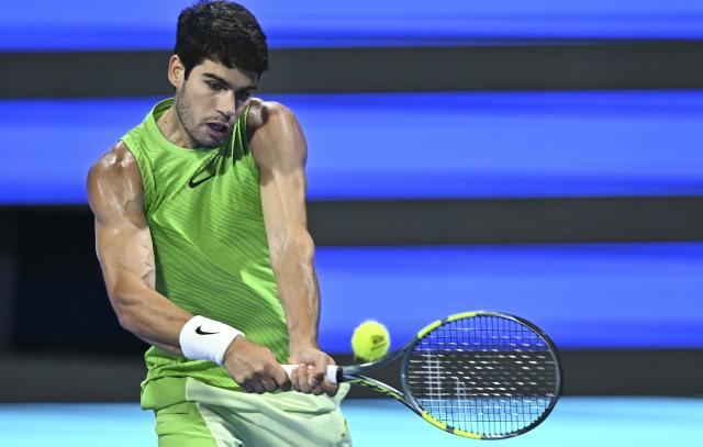 (260220) -- DOHA, Feb. 20, 2026 (Xinhua) -- Carlos Alcaraz of Spain hits a return during the men's singles quarterfinal match between Carlos Alcaraz of Spain and Karen Khachanov of Russia at the ATP Qatar Open 2026 tennis tournament in Doha, Qatar, Feb. 19, 2026. (Photo by Nikku/Xinhua)