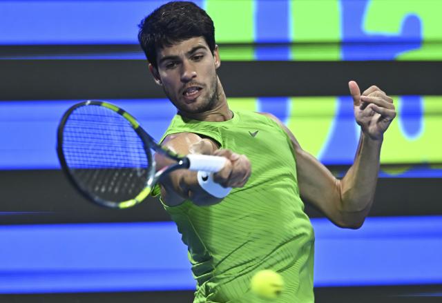 (260220) -- DOHA, Feb. 20, 2026 (Xinhua) -- Carlos Alcaraz of Spain hits a return during the men's singles quarterfinal match between Carlos Alcaraz of Spain and Karen Khachanov of Russia at the ATP Qatar Open 2026 tennis tournament in Doha, Qatar, Feb. 19, 2026. (Photo by Nikku/Xinhua)