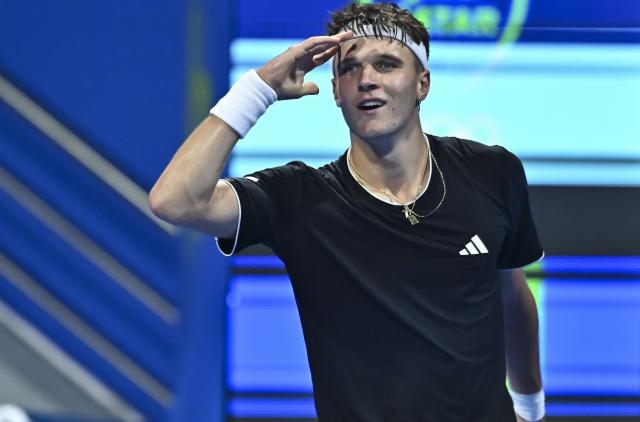 (260220) -- DOHA, Feb. 20, 2026 (Xinhua) -- Jakub Mensik of the Czech Republic reacts during the men's singles quarterfinal match between Jannik Sinner of Italy and Jakub Mensik of the Czech Republic at the ATP Qatar Open 2026 tennis tournament in Doha, Qatar, Feb. 19, 2026. (Photo by Nikku/Xinhua)