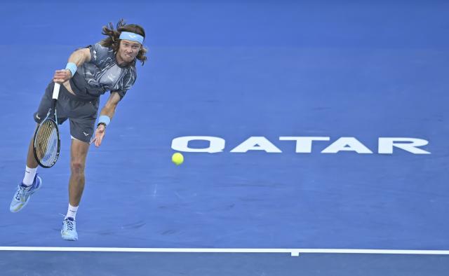 (260220) -- DOHA, Feb. 20, 2026 (Xinhua) -- Andrey Rublev of Russia serves during the men's singles quarterfinal match between Andrey Rublev of Russia and Stefanos Tsitsipas of Greece at the ATP Qatar Open 2026 tennis tournament in Doha, Qatar, Feb. 19, 2026. (Photo by Nikku/Xinhua)