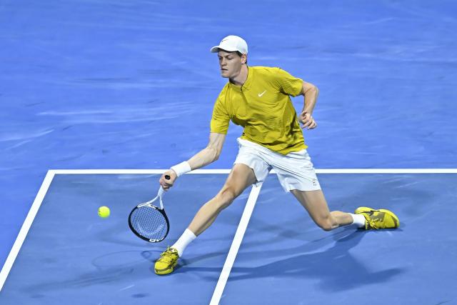 (260220) -- DOHA, Feb. 20, 2026 (Xinhua) -- Jannik Sinner of Italy hits a return during the men's singles quarterfinal match between Jannik Sinner of Italy and Jakub Mensik of the Czech Republic at the ATP Qatar Open 2026 tennis tournament in Doha, Qatar, Feb. 19, 2026. (Photo by Nikku/Xinhua)