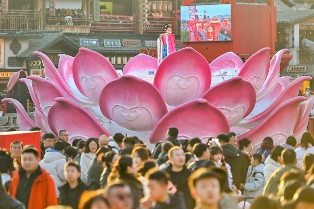 (260220) -- BEIJING, Feb. 20, 2026 (Xinhua) -- A performance is staged at Hetou ancient street scenic area in Tangshan, north China's Hebei Province, Feb. 19, 2026. China's Ministry of Culture and Tourism launched a month-long cultural and tourism campaign ahead of the Spring Festival, featuring a wide range of activities and promotional measures to better meet people's needs.
   Running from late January to early March, the campaign will see about 30,000 activities held nationwide, offering seasonal cultural and tourism products and events focused on traditional New Year customs, performances, and exhibitions.
   More than 360 million yuan (about 51.6 million U.S. dollars) in consumption vouchers and subsidies will be distributed, alongside measures such as ticket discounts, bundled ticket incentives, and cross-regional tourism promotions. (Photo by Du Penghui/Xinhua)